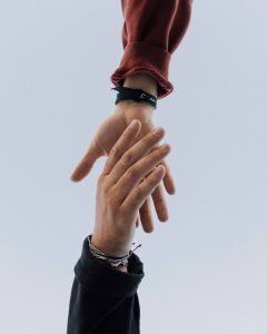 View of two persons hands (Photo by Austin Kehmeler on Unsplash)